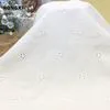 China Wholesale Crf2184 Ready White Bulk European Cotton Small Flower Eyelet Embroidery Fabric for Kids and Women Clothing