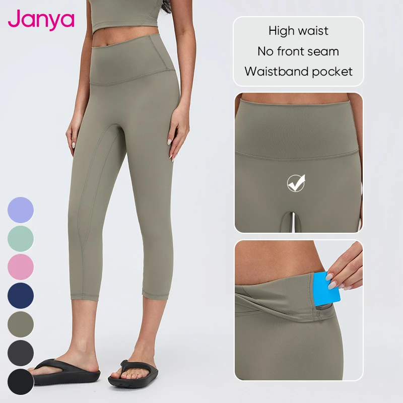 Janya Soft Breathable Wide-Rise No Front Seam Crop Tight Fitness Sports Pants High Elastic Waist Yoga Capri Leggings with Pocket
