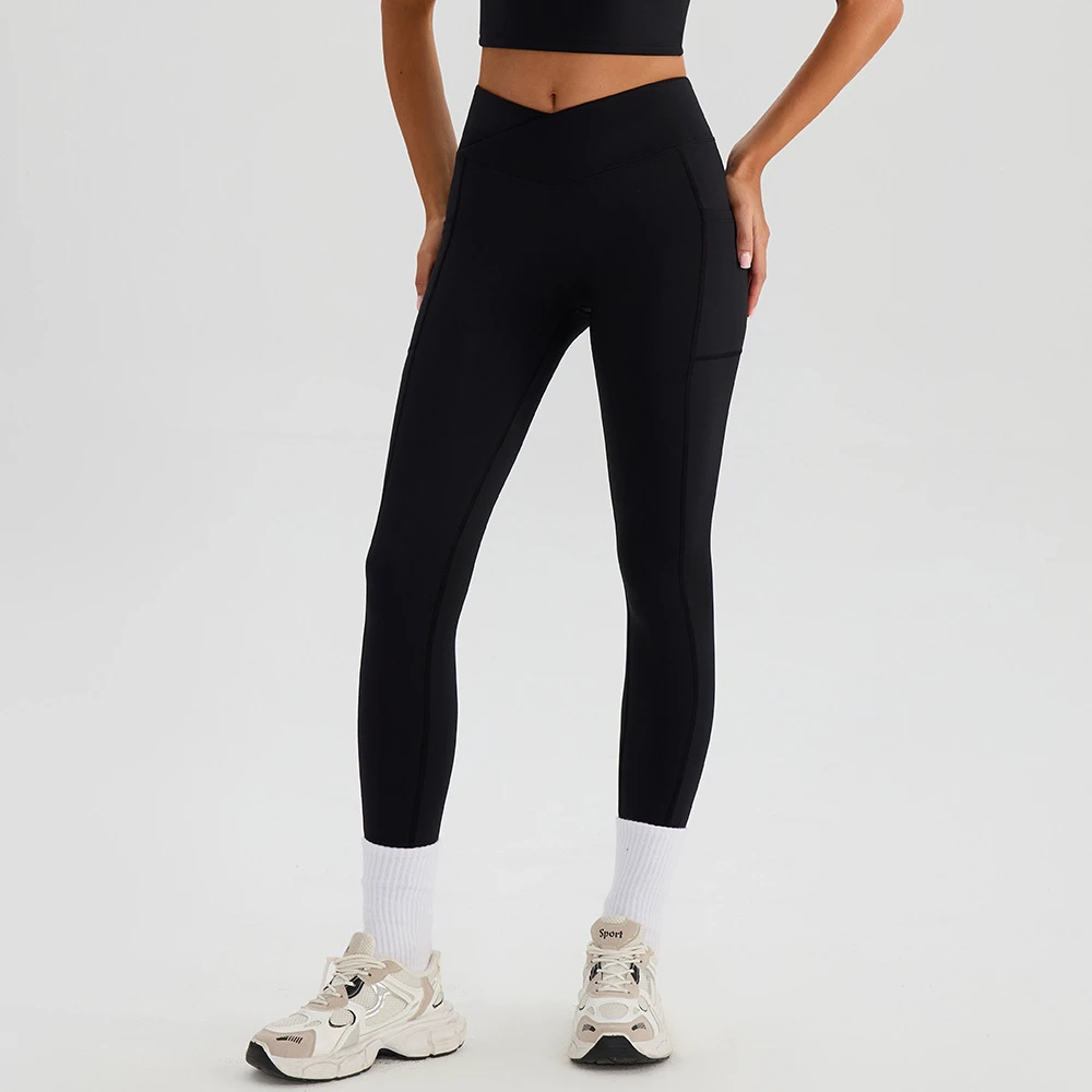 Women's High-Waisted Crisscross Yoga Leggings with Side Pockets Tummy Control Stretchable for Gym Workouts